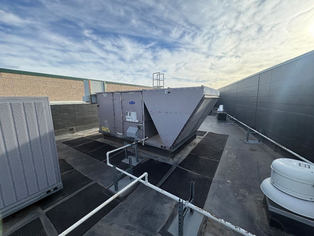 Commercial rooftop HVAC equipment under a Colorado sky
